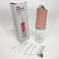 Ирригатор для чистки зубов и полости рта Oral Irrigator с аккумулятором и сменными насадками Pink